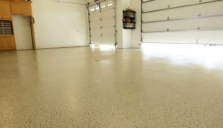 Two-car garage with a tan flake floor coating